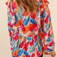 Brush Stroke Ruffled Tie Neck Blouse